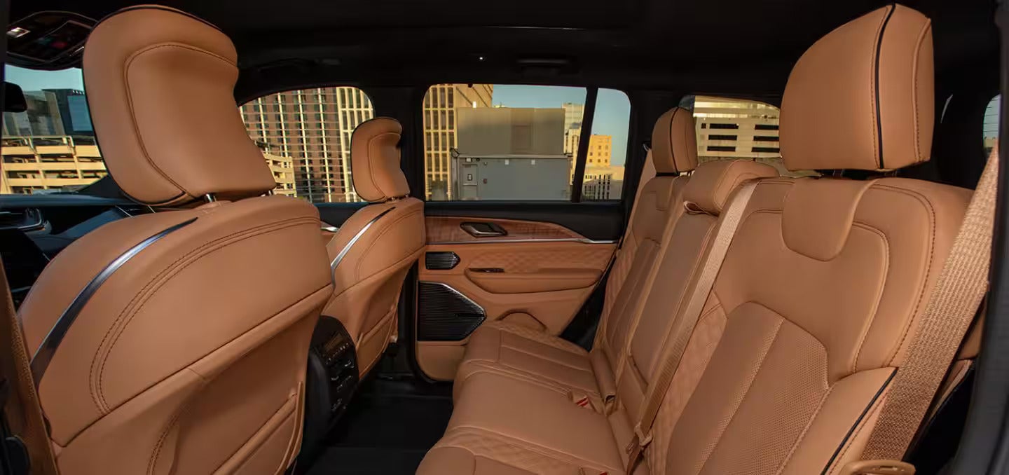 the side interior of a jeep grand cherokee featuring leather interior seating