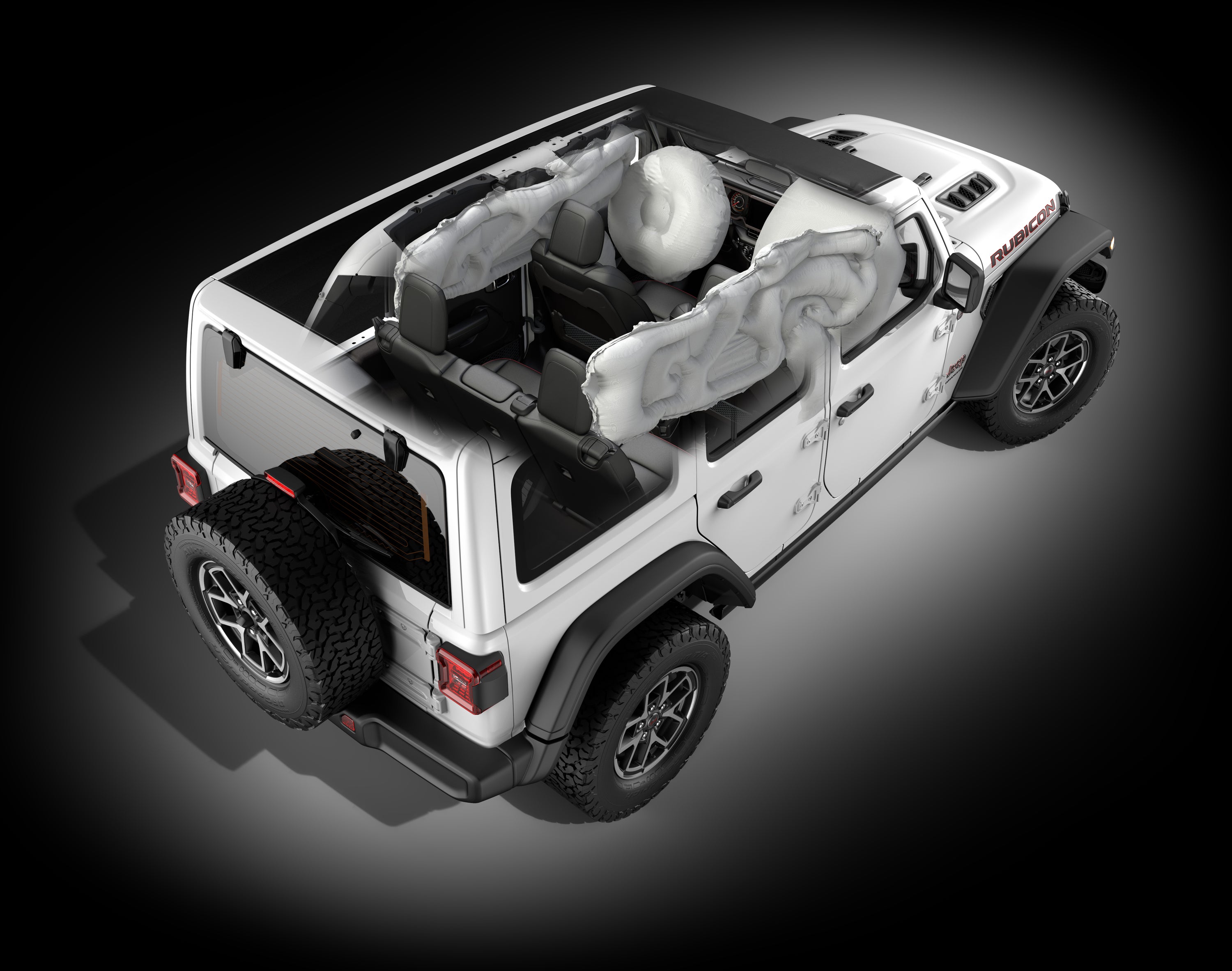 a white jeep wrangler showing the inside airbags deployed
