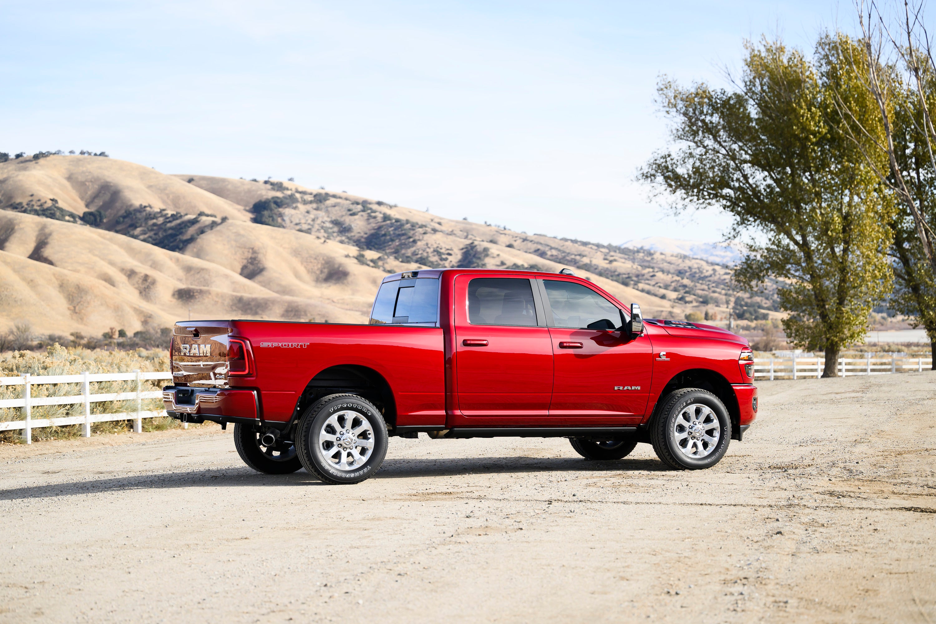 A red truck sitting on a road.