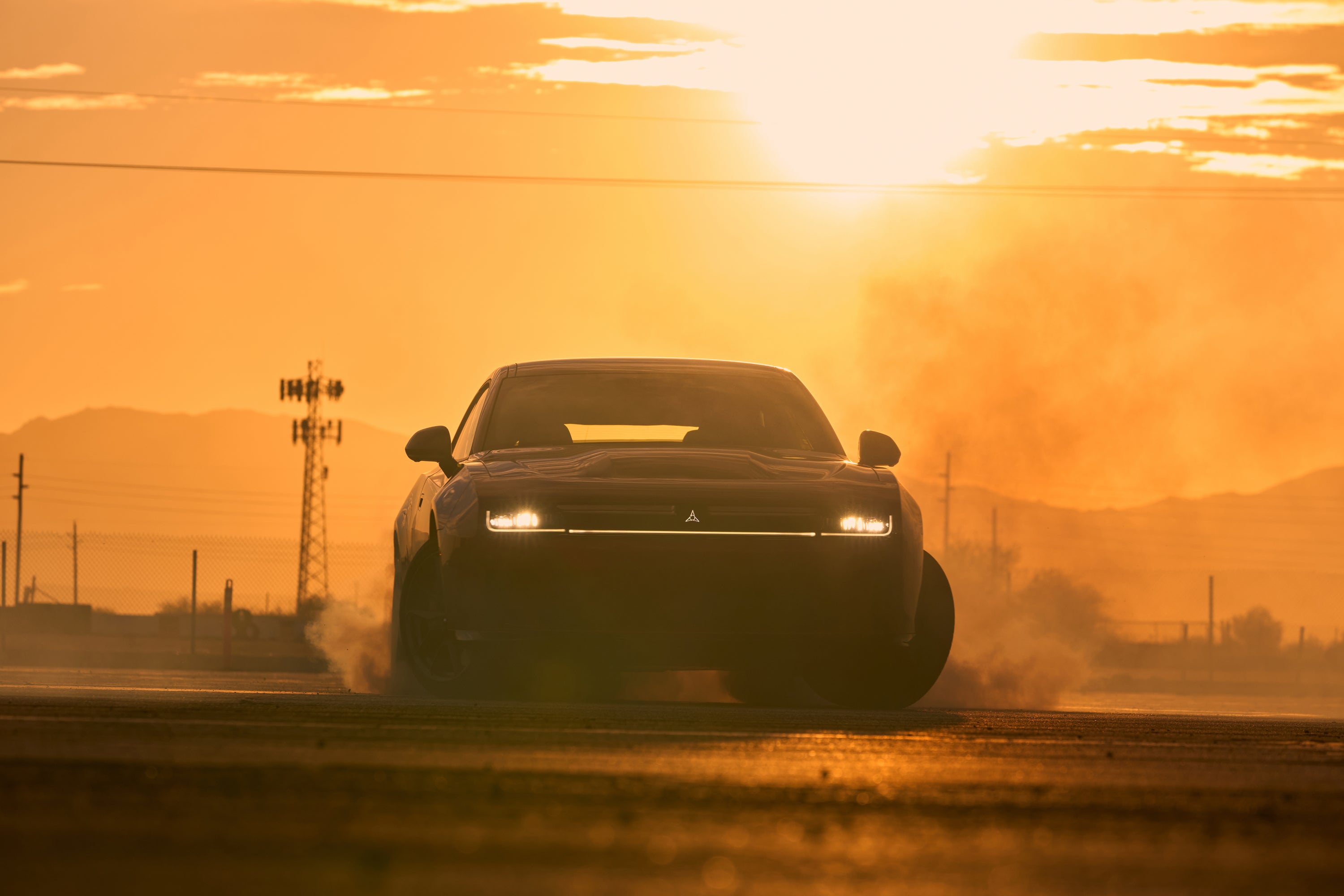 A red car driving on a road.