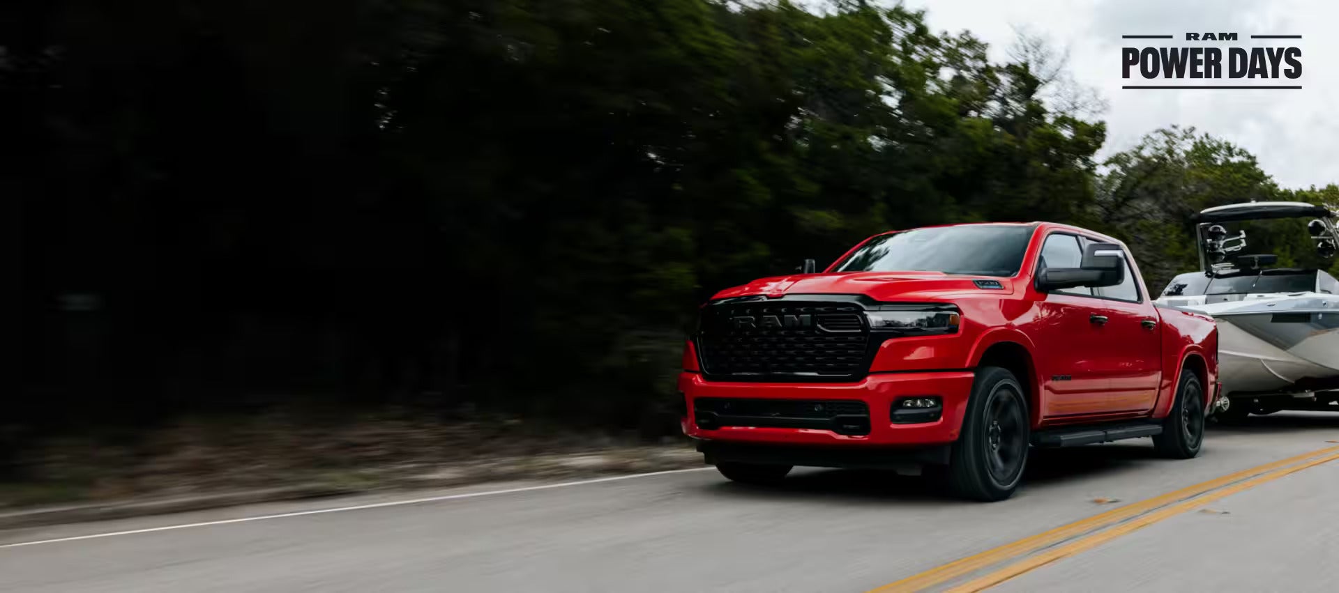 A white Ram 1500 powerslides through a desert valley.